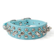 Light blue dog collar with silver spikes on a white background