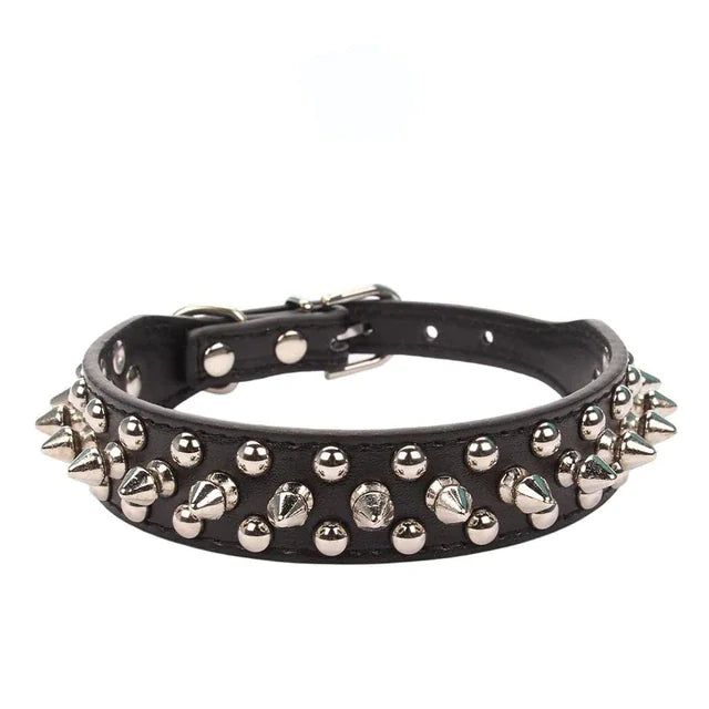 Black leather dog collar with silver spikes and studs on a white background