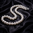 Pearl necklace on a dark, textured fabric background