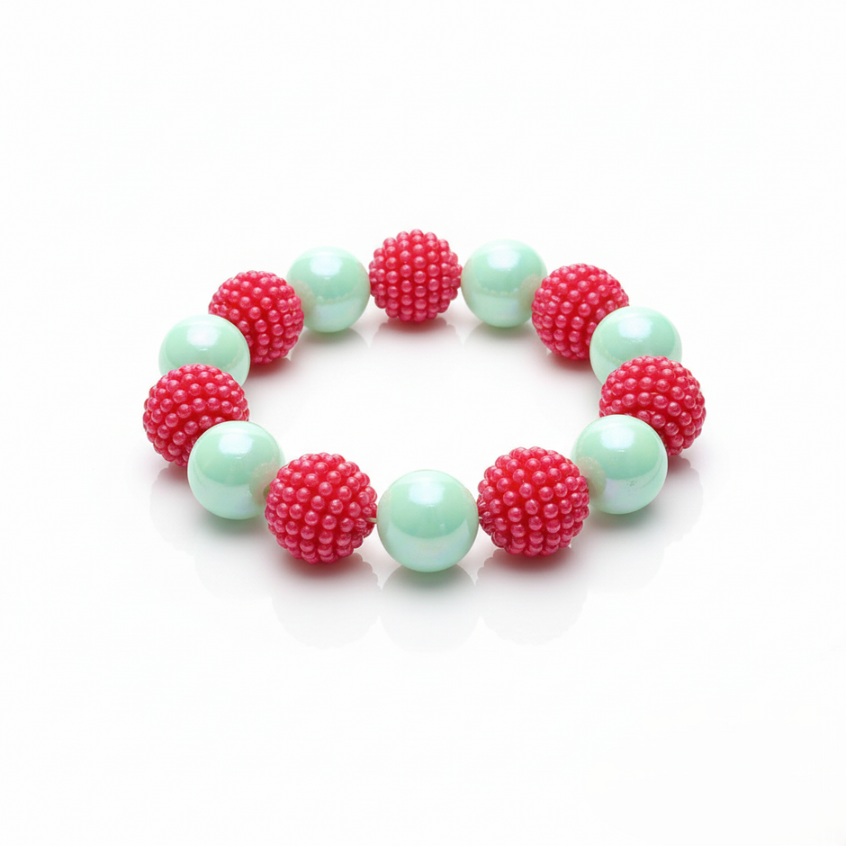 Bracelet with pink and green beads on a white background