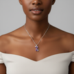 Woman wearing a silver necklace with a purple pendant against a gray background
