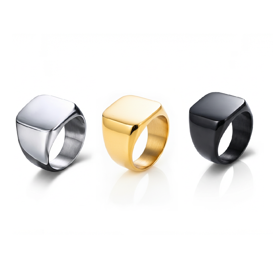 Three SteelForce rings for men - 316L stainless steel band in silver, gold, and black on a white background