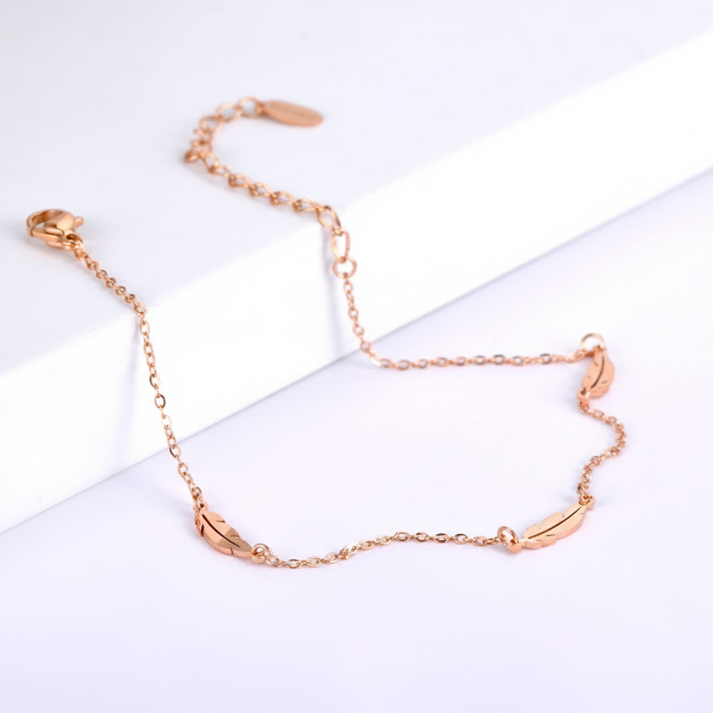 Rose gold anklet on a white background
