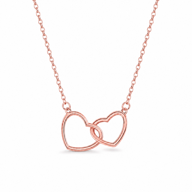 Rose gold necklace with interlocking heart pendants on a white background