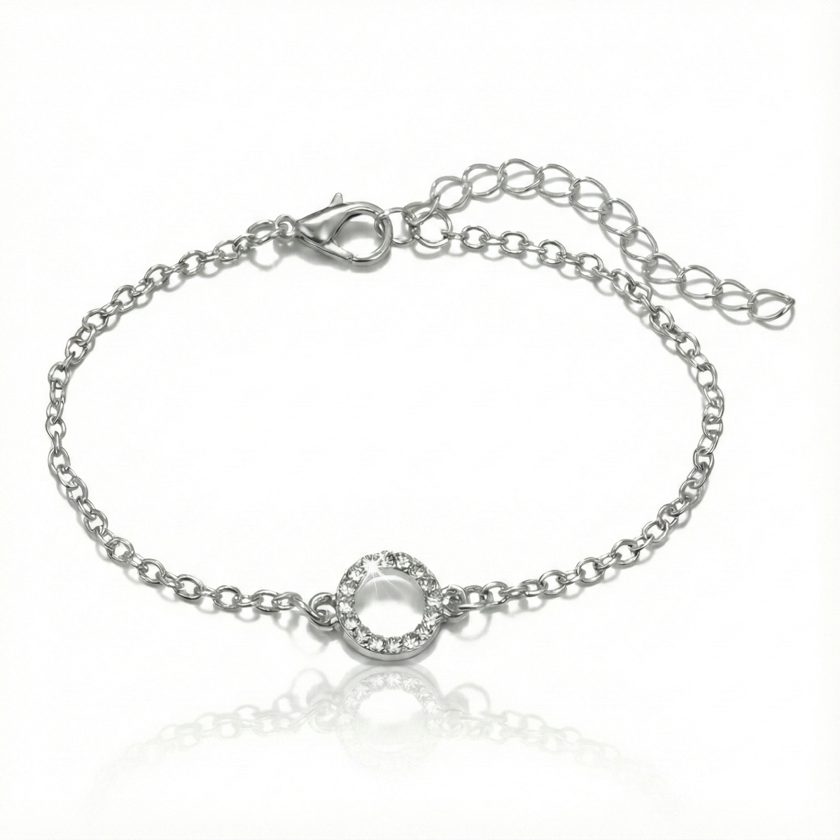 Silver bracelet with a small round clasp on a white background