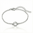 Silver bracelet with a small round clasp on a white background