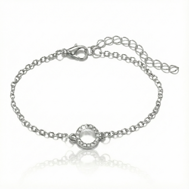 Silver bracelet with a small round clasp on a white background