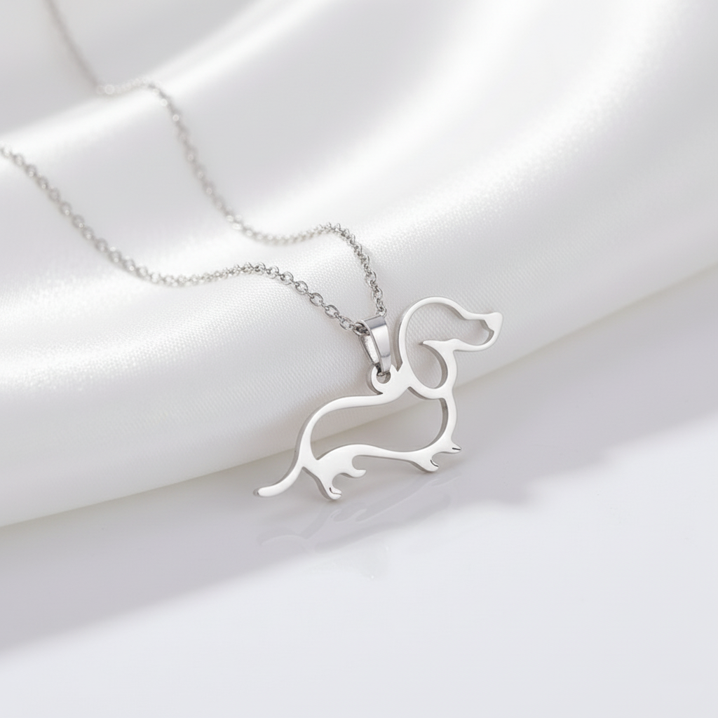 Silver dachshund-shaped pendant on a chain 