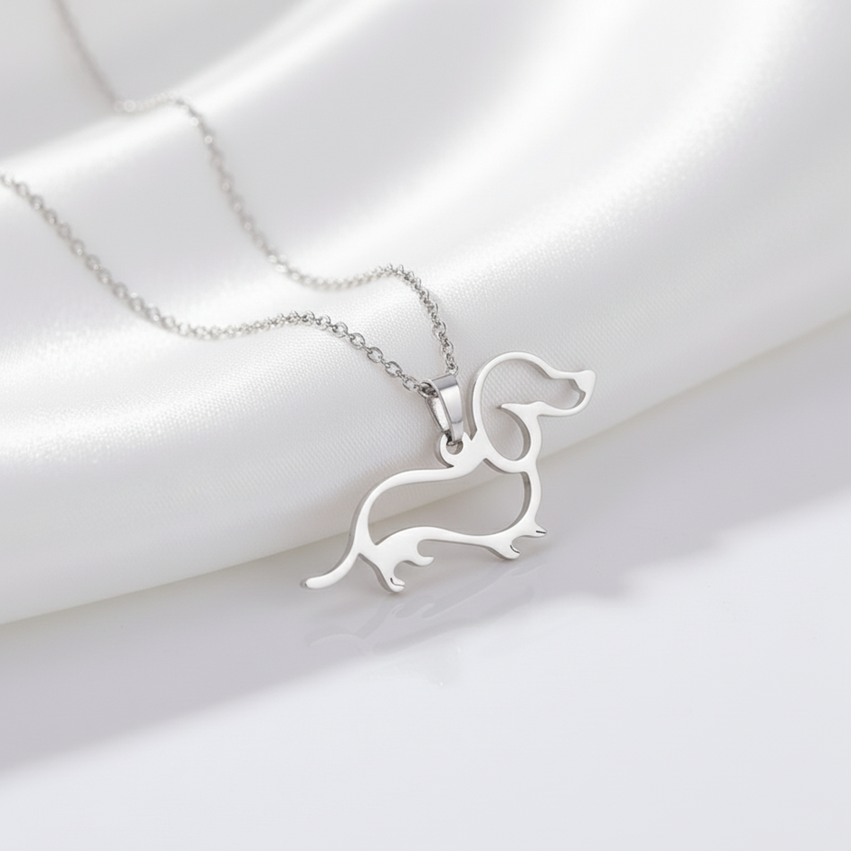 Silver dachshund-shaped pendant on a chain 