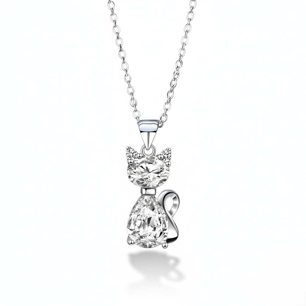 Cat-shaped diamond pendant on a chain against a white background