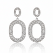 Pair of silver oval earrings with clear stones on a white background