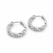 Pair of silver hoop earrings with pearls on a white background