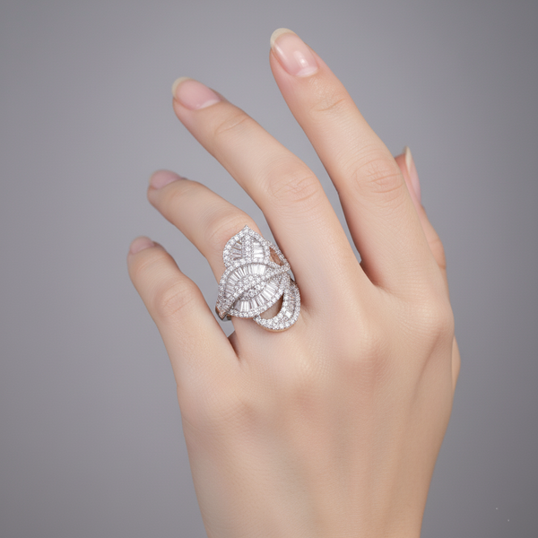 Hand wearing a decorative Regalia Crystal Ring on a gray background